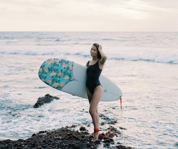 A man standing at sunset feeling energized and calm