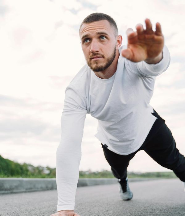 Strong athletic man focused on his morning exercise routine